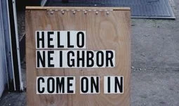 A sign that says hello neighbor come on in