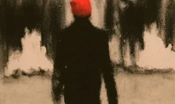 a man in paris with an orange hat