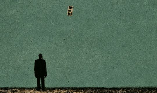 a man staring at a flying dollar bill