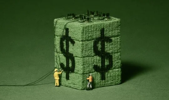 a big green block with a dollar sign on it and some small men adding electrical cables 