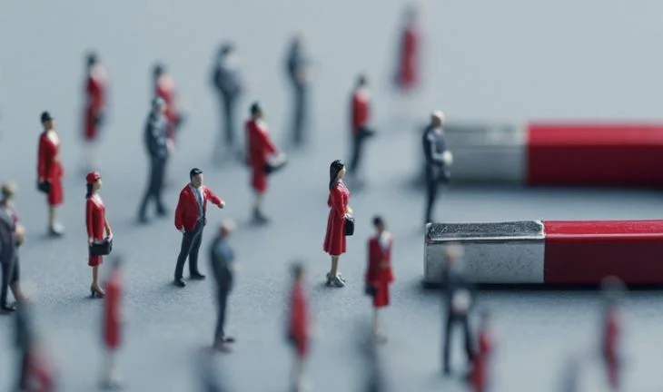 A magnet and miniature people 
