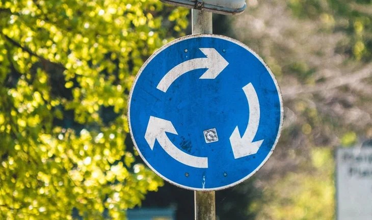 a roundabout sign