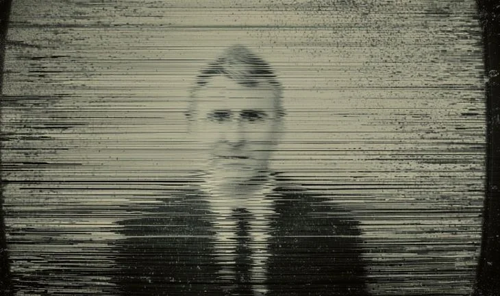 Ken Griffin on a blurred TV 