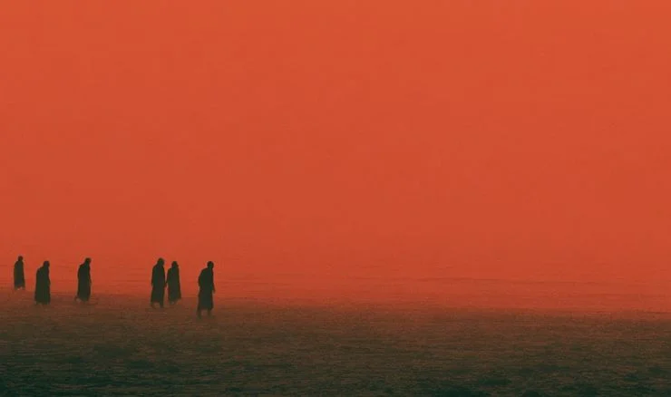 some people going into a red sea 