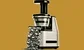 a juicer with dollars coming out 